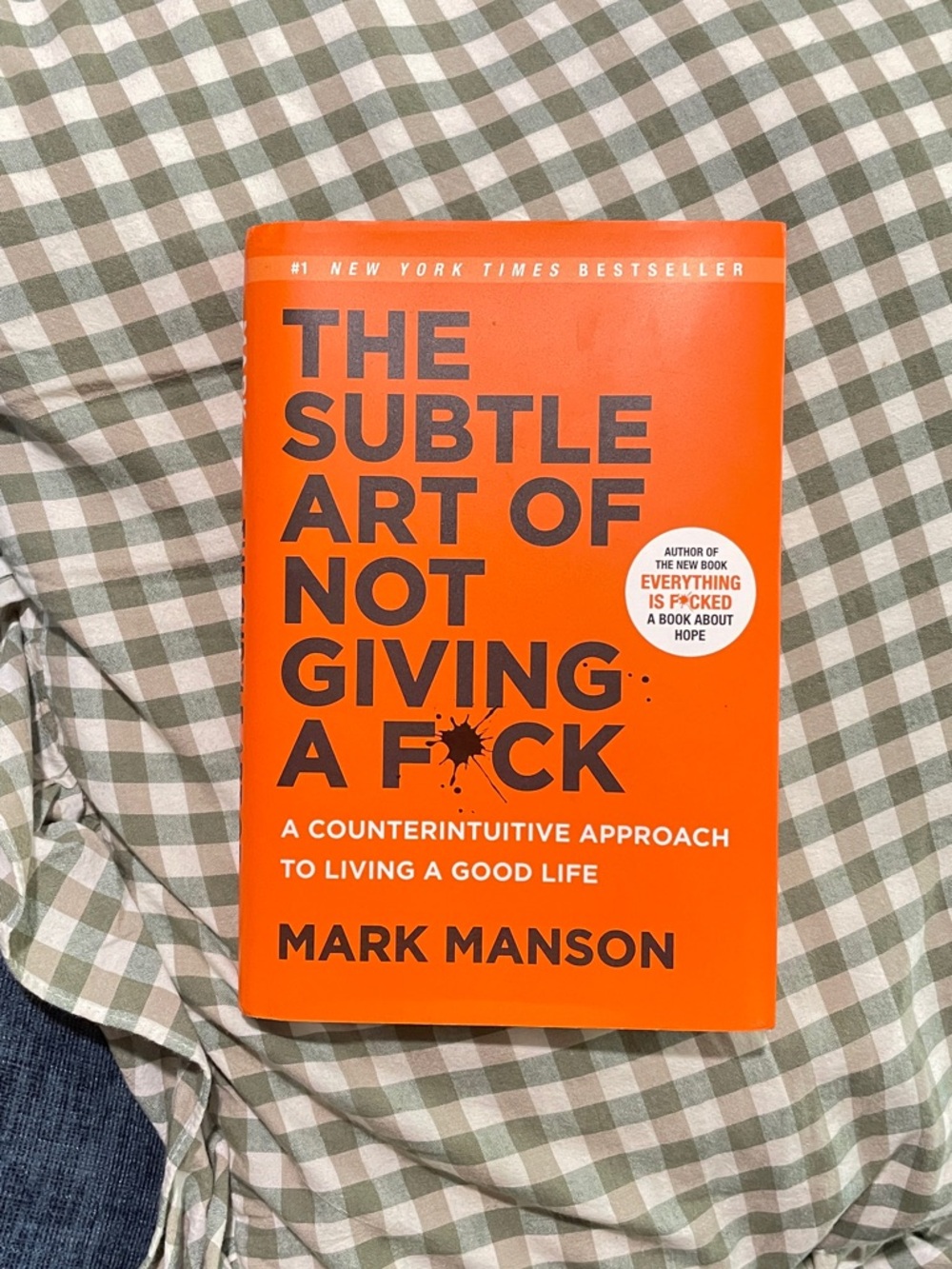The Subtle Art of Not Giving a F*ck by Mark Manson - Bright Orange Paperback